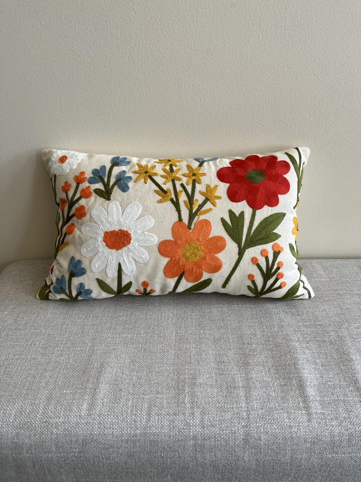 Customer living room with an embroidered pillow cover