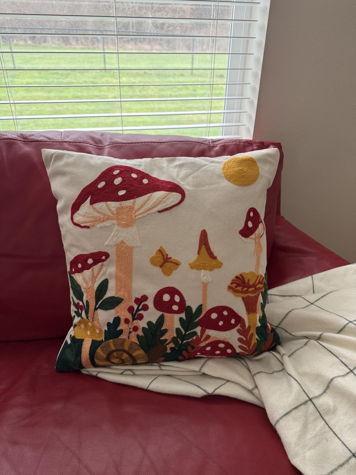Mushroom Moon embroidered pillow cover styled by a customer